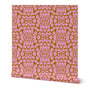 Pink and orange patterned roll of wallpaper on a white background. Designed by artist Leila Simon Hayes.