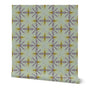 Roll of fabric with a geometric pattern on a white background. Designed by artist Leila Simon Hayes.