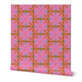 Roll of wallpaper with a pink and orange geometric pattern on a white background. Designed by artist Leila Simon Hayes. 