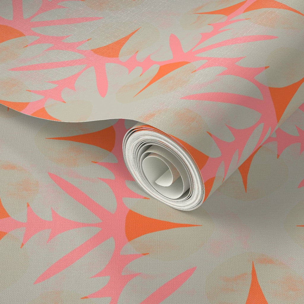 Roll of wallpaper with pink and orange abstract leaf pattern on a light background. Designed by artist Leila Simon Hayes.