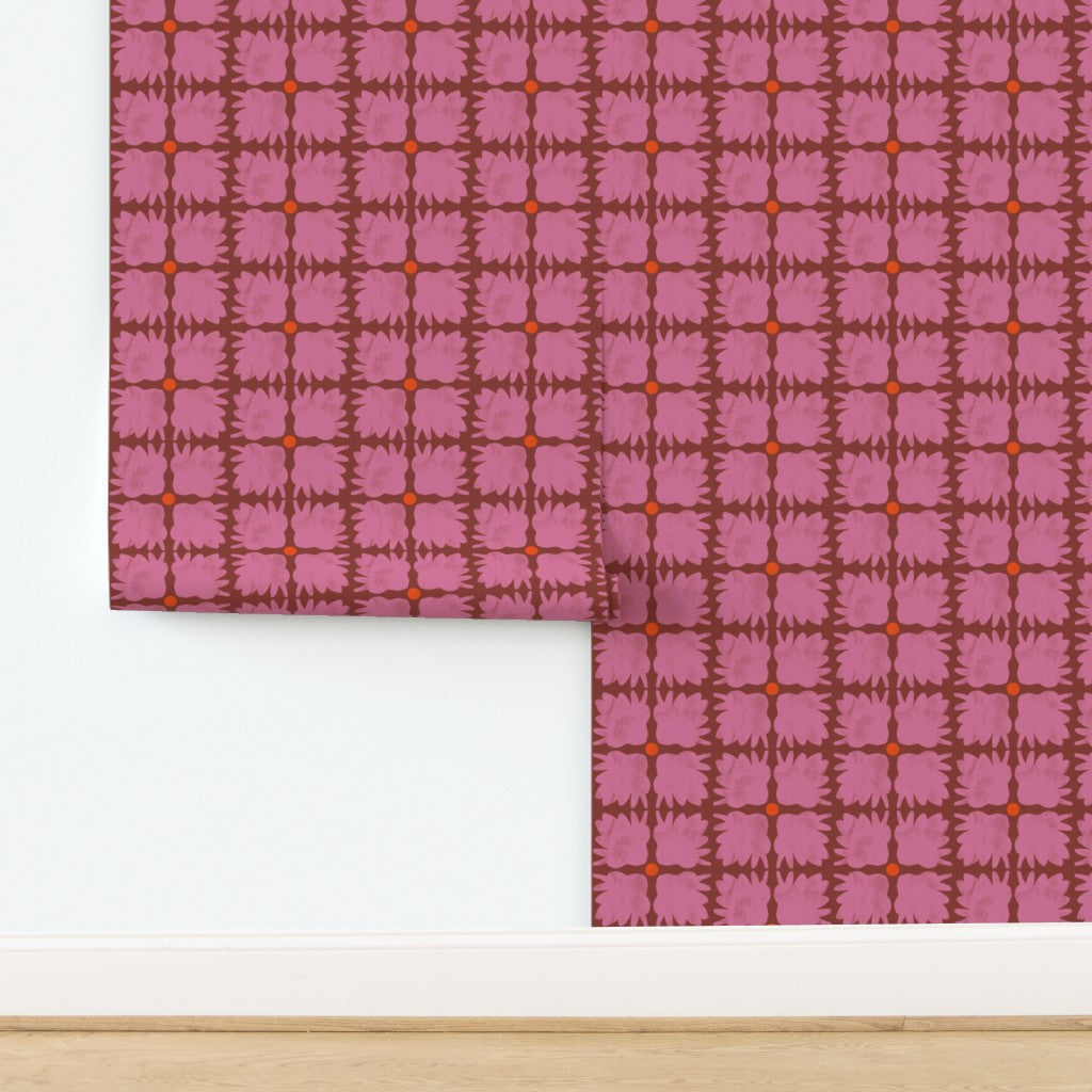 Roll of floral-patterned wallpaper with a white border on a wooden surface. Designed by artist Leila Simon Hayes.