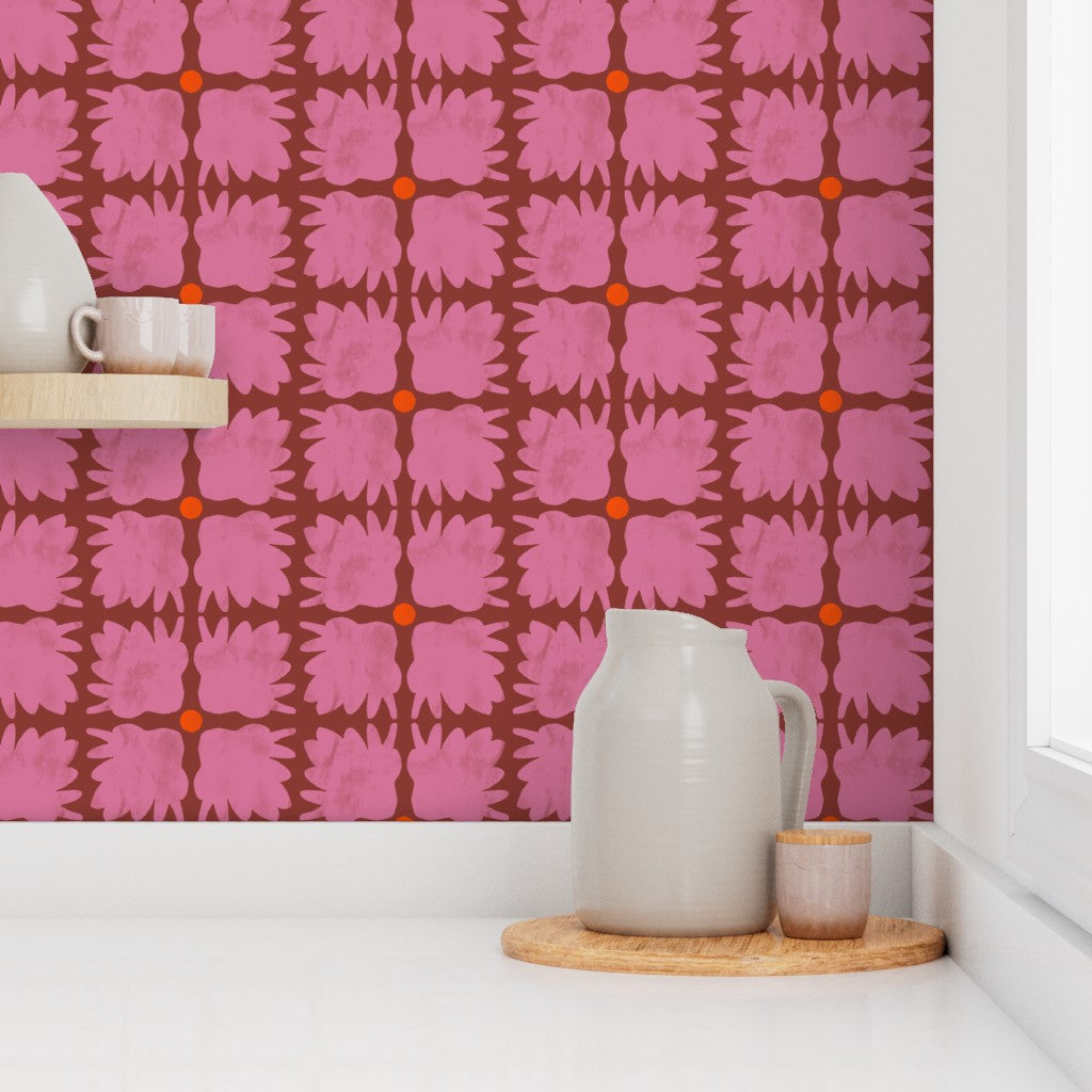 Kitchen setup with pink patterned wallpaper, white pitcher, and small container on a wooden tray. Designed by artist Leila Simon Hayes.