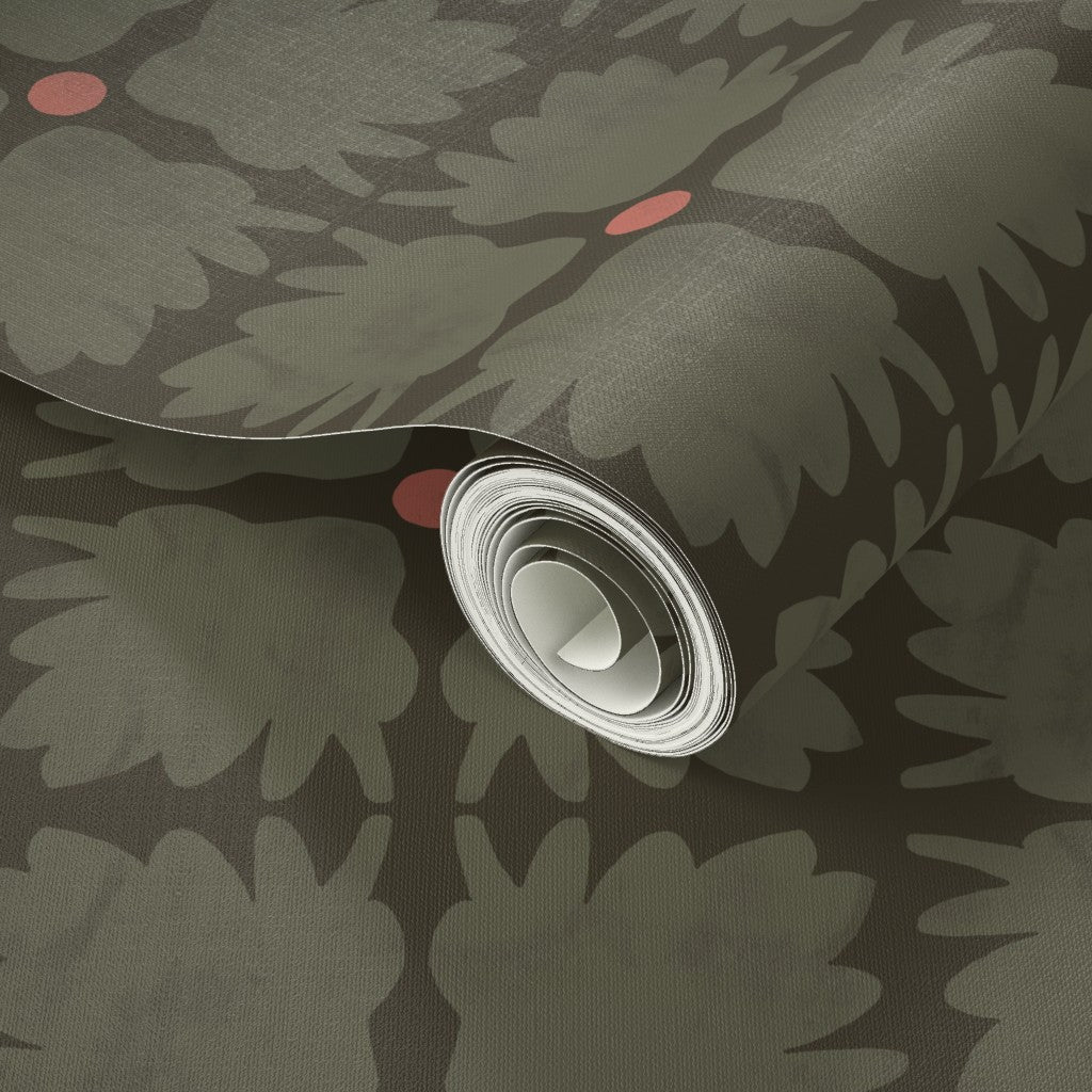 Roll of green floral wallpaper with a central peach circle. Designed by artist Leila Simon Hayes.
