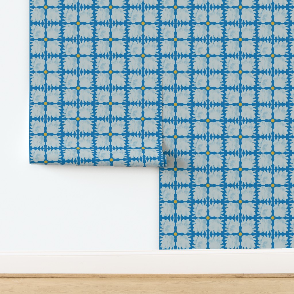 Roll of blue patterned paper on a white background. Designed by artist Leila Simon Hayes.