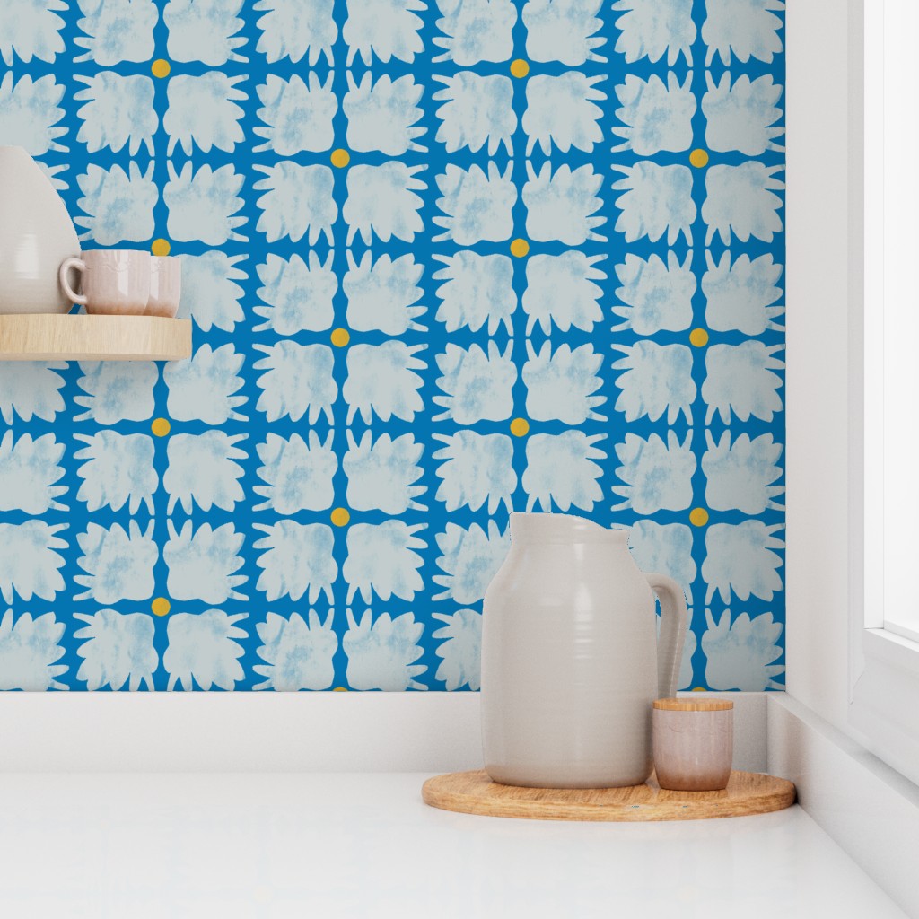Kitchen scene with a blue patterned wall, white pitcher, and wooden tray. Designed by artist Leila Simon Hayes.