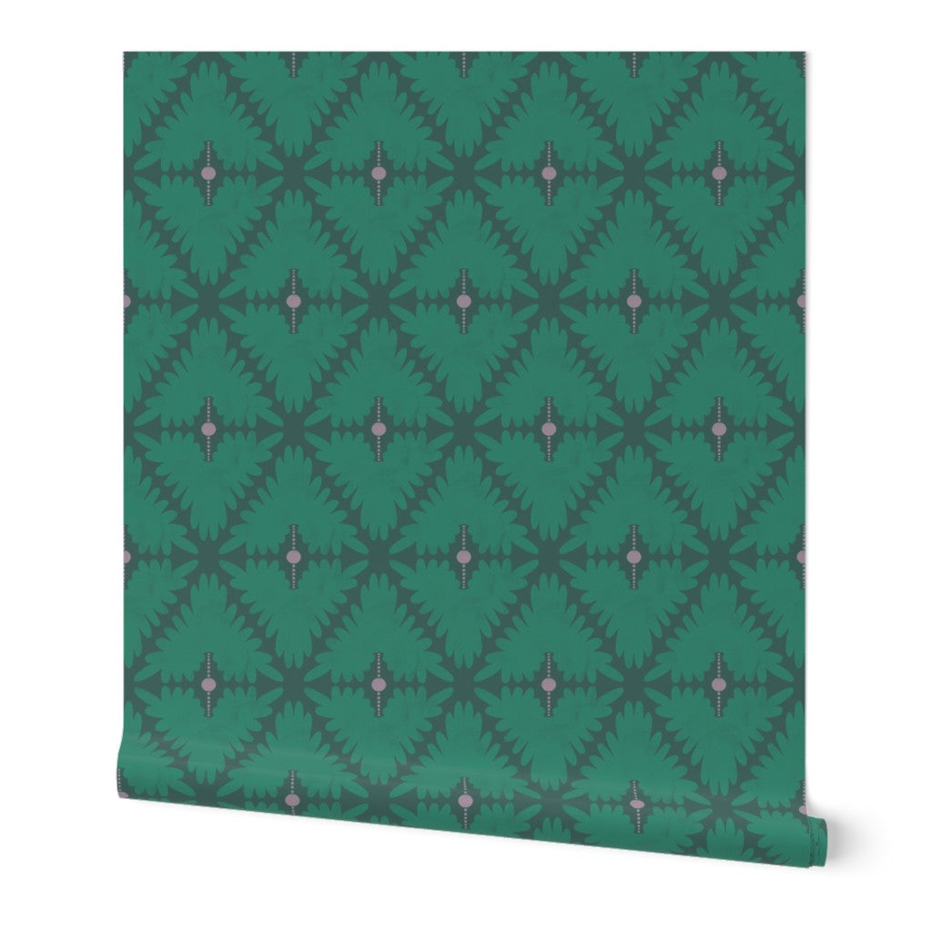 Green roll of wallpaper with a geometric pattern on a white background. Designed by artist Leila Simon Hayes. 
