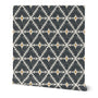 Patterned black and white roll of wallpaper  with geometric design on a white background. Designed by artist Leila Simon Hayes. 
