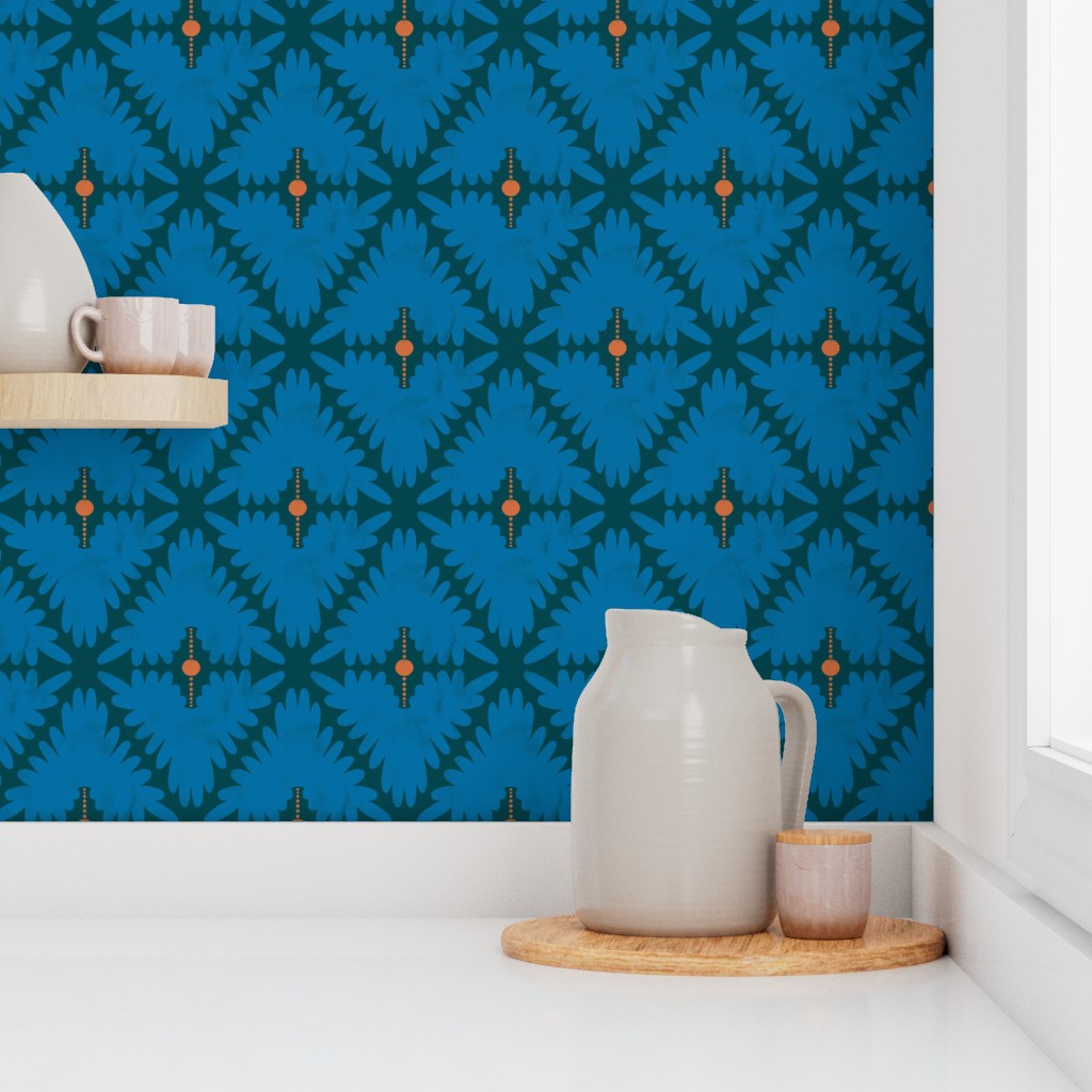 Kitchen setup with a blue patterned wall, white pitcher, and wooden tray. Designed by artist Leila Simon Hayes. 