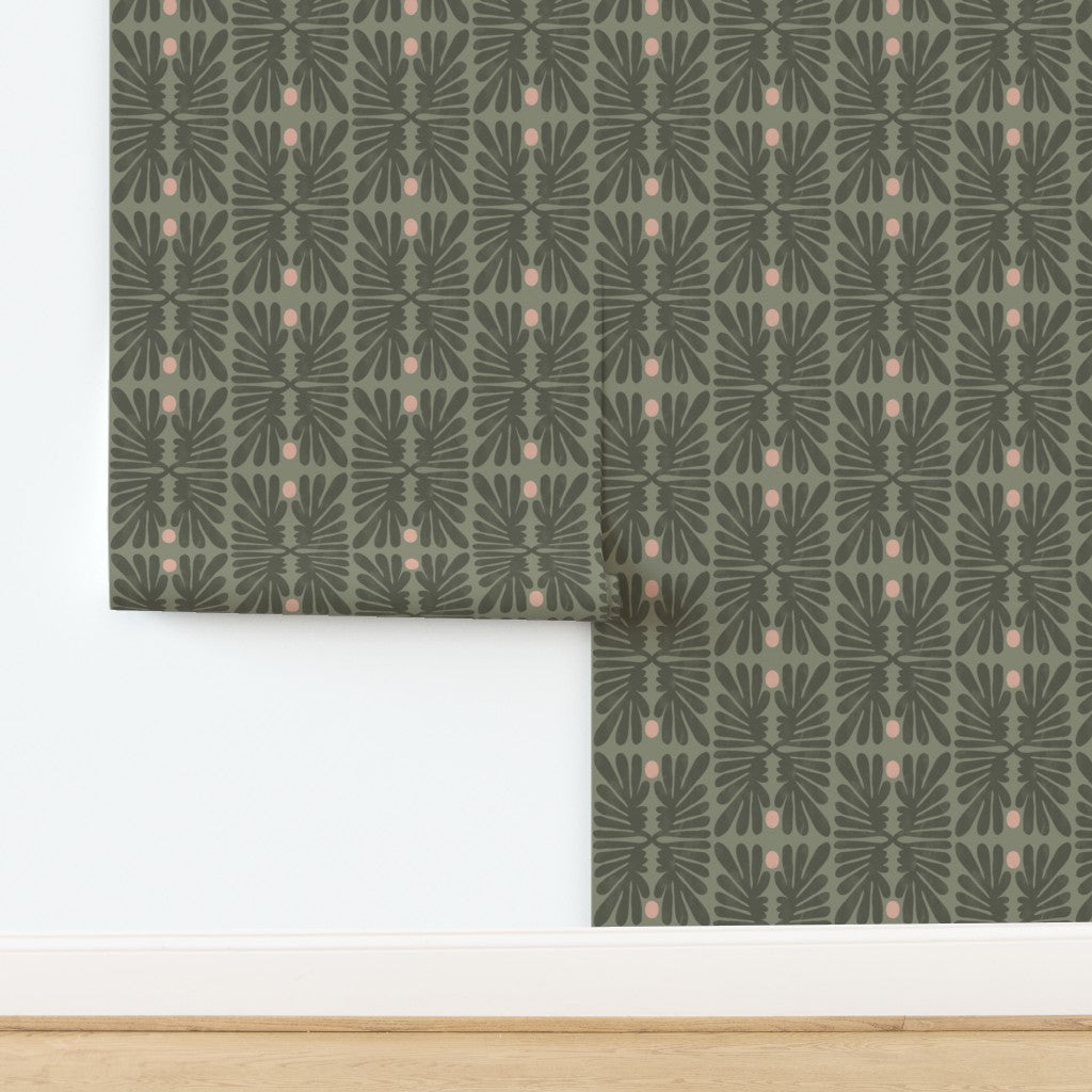 Green patterned wallpaper roll on a white background. Designed by artist Leila Simon Hayes. 