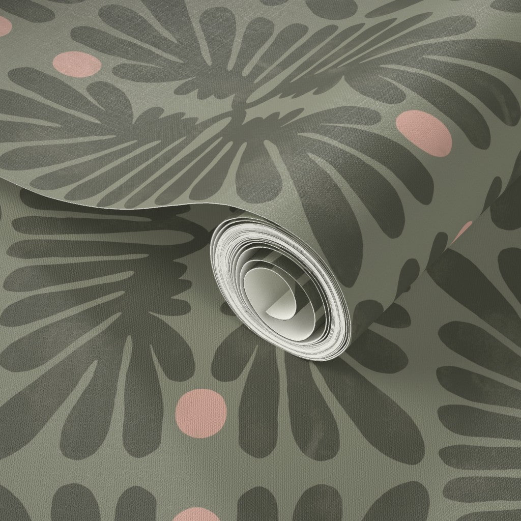 Roll of olive green wallpaper with a floral pattern on a green background. Designed by artist Leila Simon Hayes. 