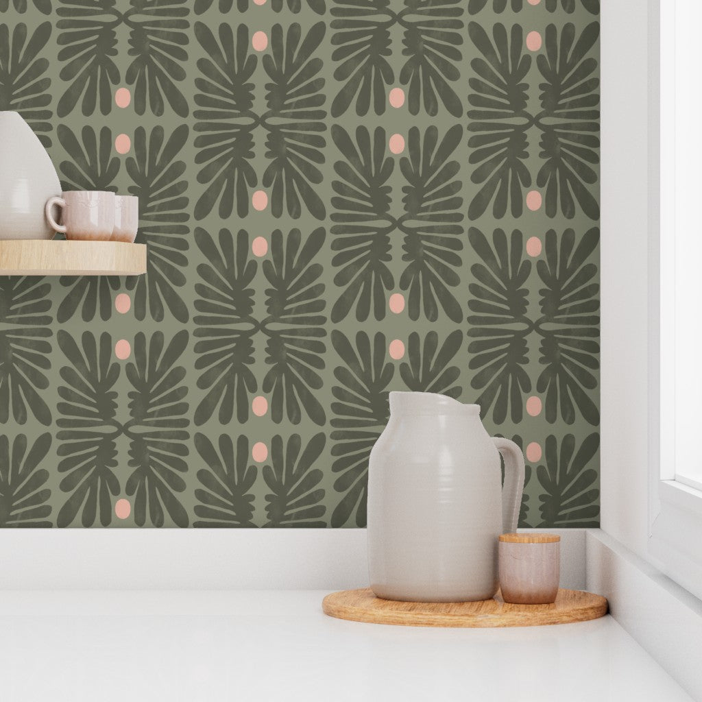 Kitchen counter against a green leaf-patterned wall. Designed by artist Leila Simon Hayes. 