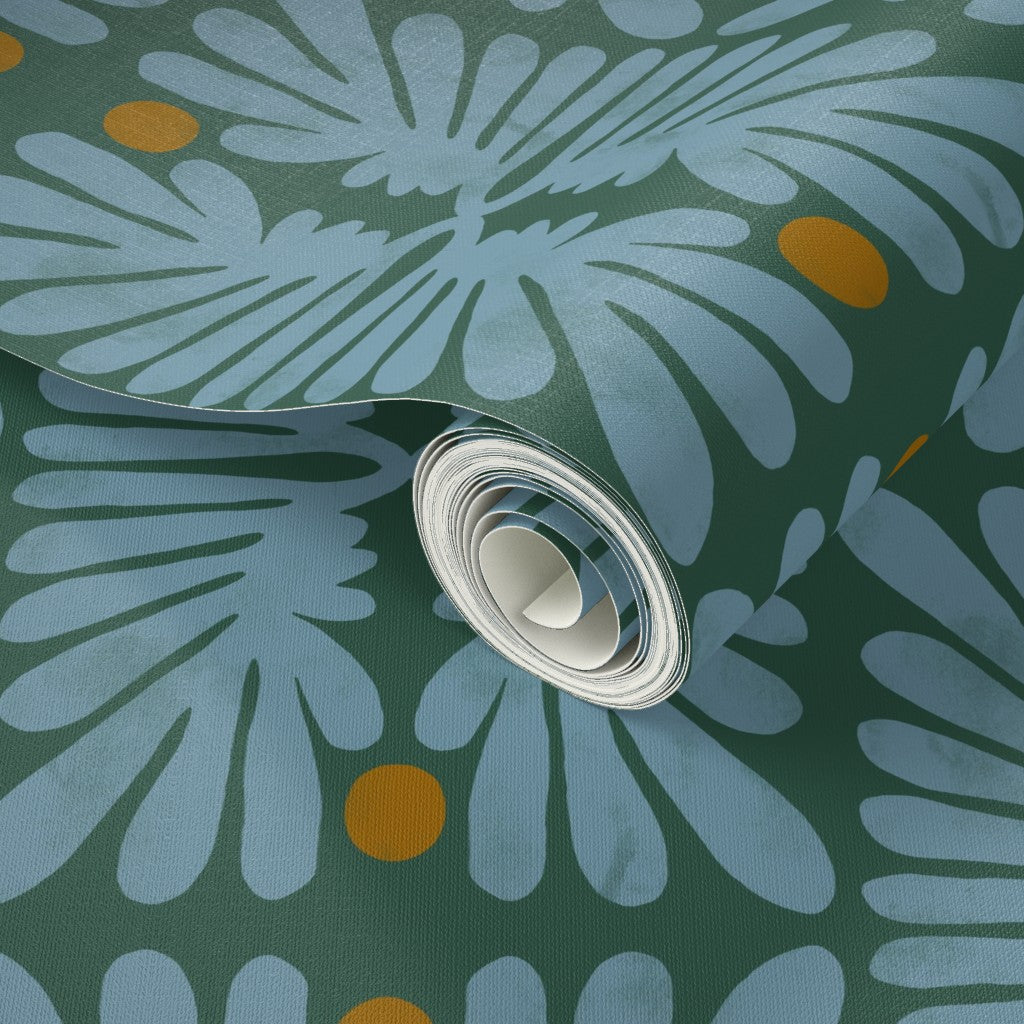 Roll of fabric with a floral pattern on a green background. Designed by artist Leila Simon Hayes. 