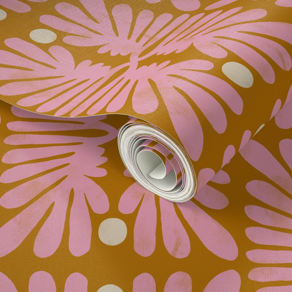 Roll of pink floral-patterned fabric on a brown background. Designed by artist Leila Simon Hayes. 