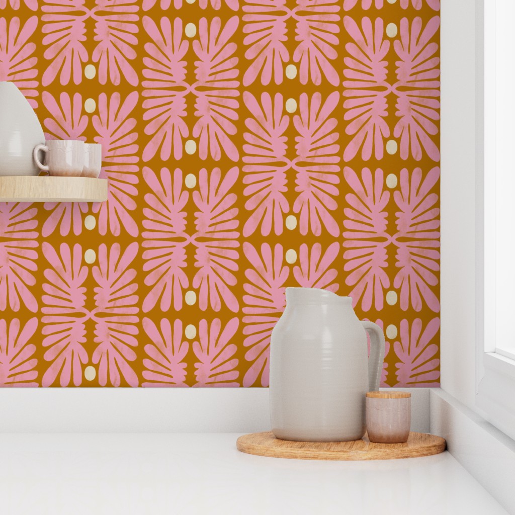 Kitchen counter with a pink leaf patterned wall, white pitcher, and small container. Designed by artist Leila Simon Hayes. 