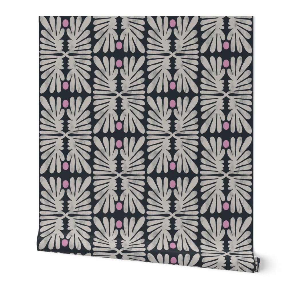 Roll of wallpaper with a geometric floral tile pattern on a white background. Designed by artist Leila Simon Hayes. 