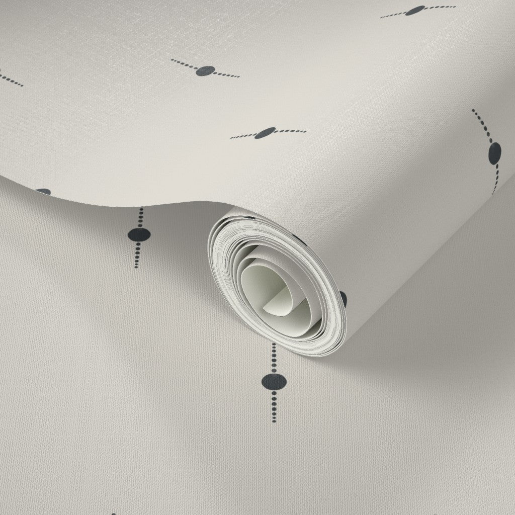 Roll of white wallpaper with suble black geometric star patterns. Designed by artist Leila Simon Hayes. 