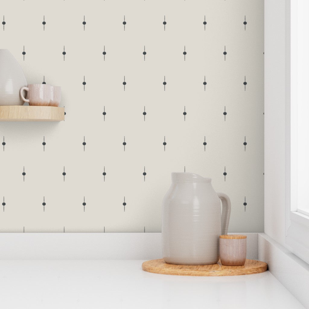A kitchen countertop against a white wallpaper with a subtle black geometric star pattern. Designed by artist Leila Simon Hayes. 