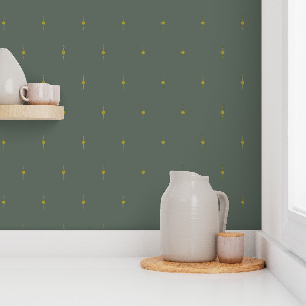 Kitchen scene with a pitcher, cups, and a wooden tray against an olive green wall with gold dot pattern. Designed by artist Leila Simon Hayes. 