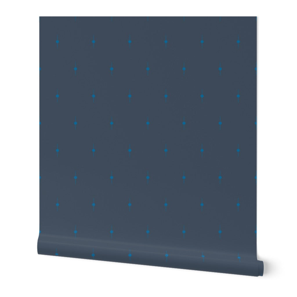 Patterned roll of wallpaper with geometric star design on a white background. Designed by artist Leila Simon Hayes. 
