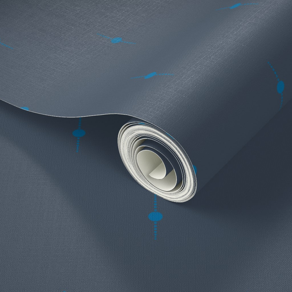 Roll of dark blue wallpaper with a bright blue geometric star design. Designed by artist Leila Simon Hayes. 