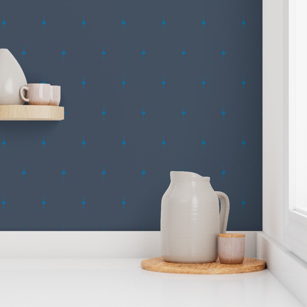 Kitchen countertop against a navy wall with blue geometric star patterns. Designed by artist Leila Simon Hayes. 