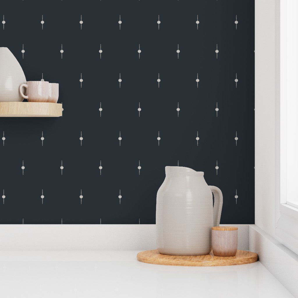 Kitchen countertops against wallpaper with small geometric star patterns. Designed by artist Leila Simon Hayes. 