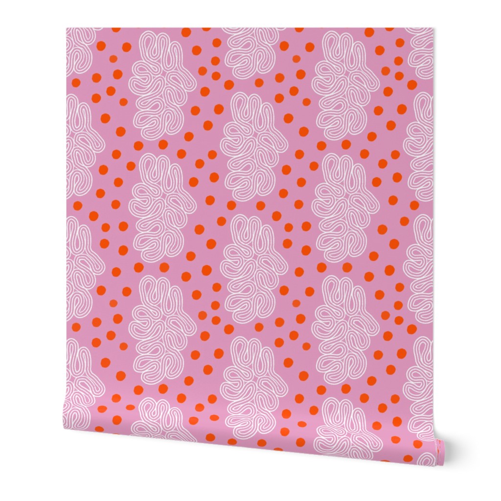 Pink paper with orange polka dot pattern and white loops. Designed by artist Leila Simon Hayes. 