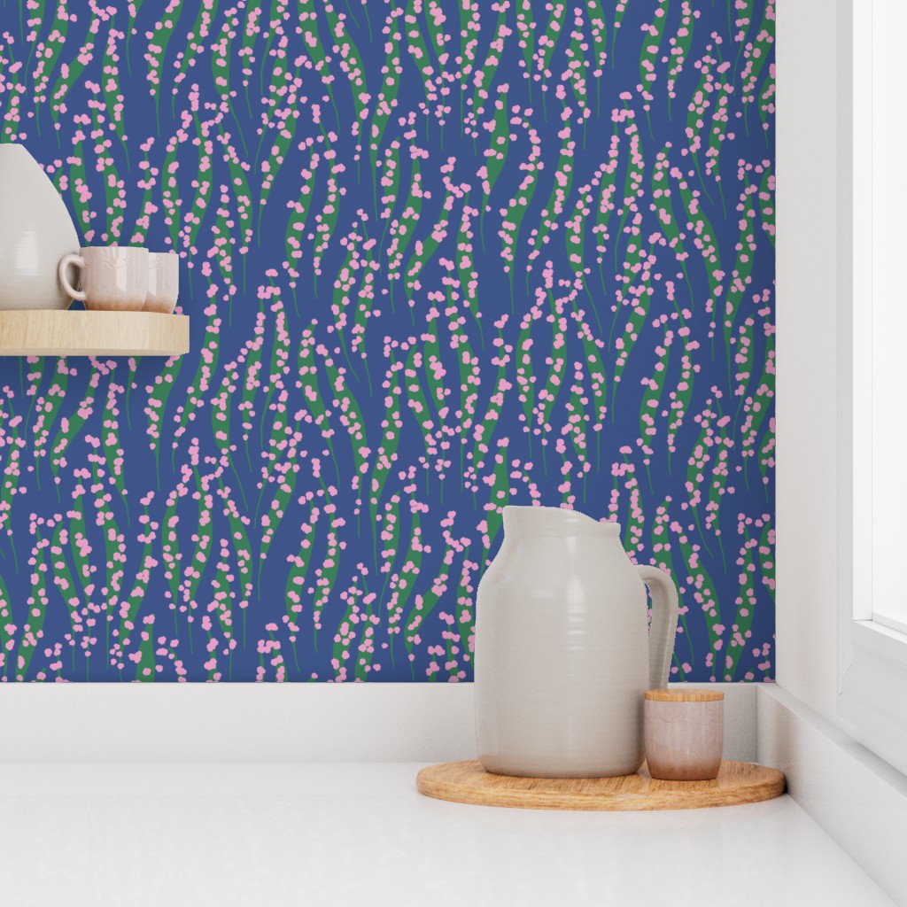 Kitchen with floral backsplash wallpaper and a white counter. Designed by Leila Simon Hayes. 