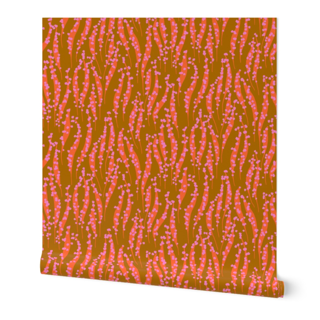 Roll of wallpaper with pink and orange abstract pattern. Designed by artist Leila Simon Hayes. 