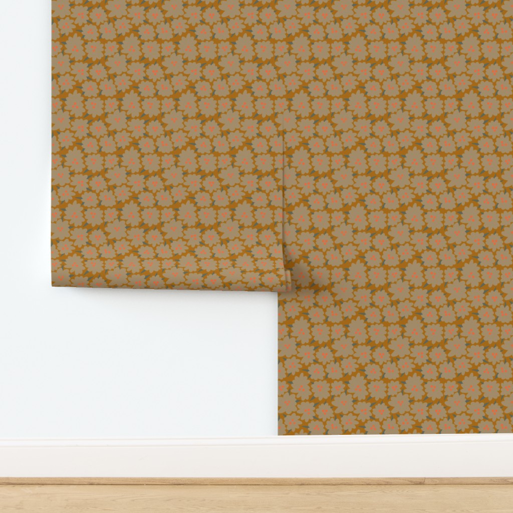 Roll of yellow floral-patterned wallpaper with a white border on a wooden surface. Designed by artist Leila Simon Hayes.