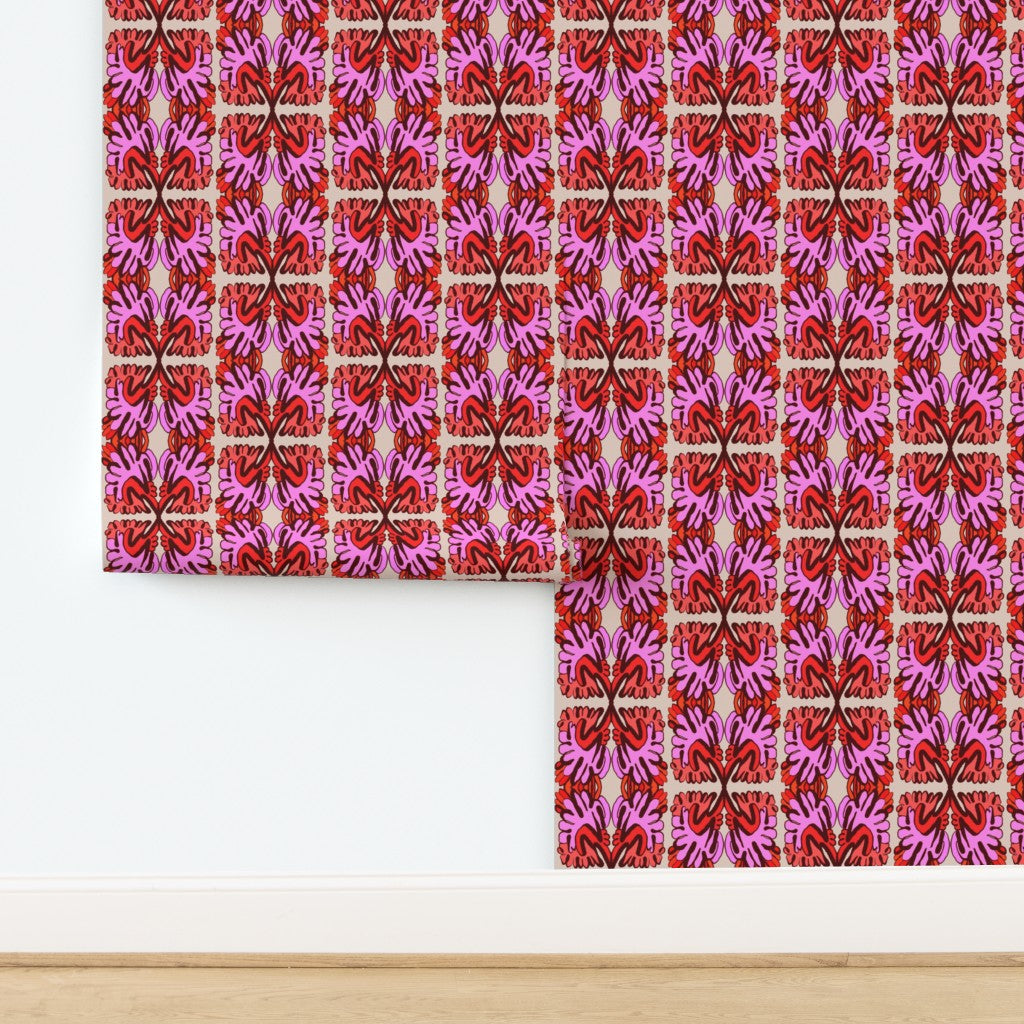 Patterned wallpaper with pink and red design on a white wall. Designed by artist Leila Simon Hayes.