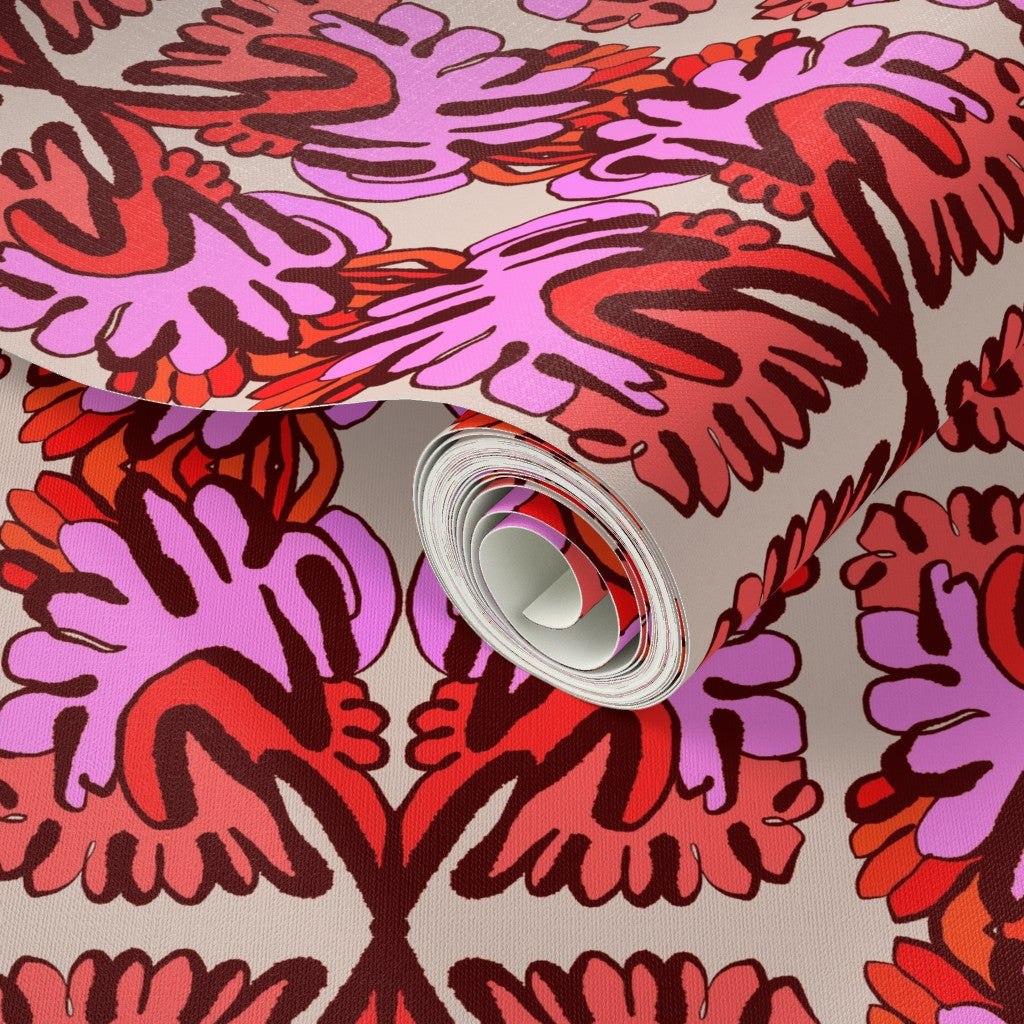 Close-up of a roll of red and pink patterned paper. Designed by artist Leila Simon Hayes.