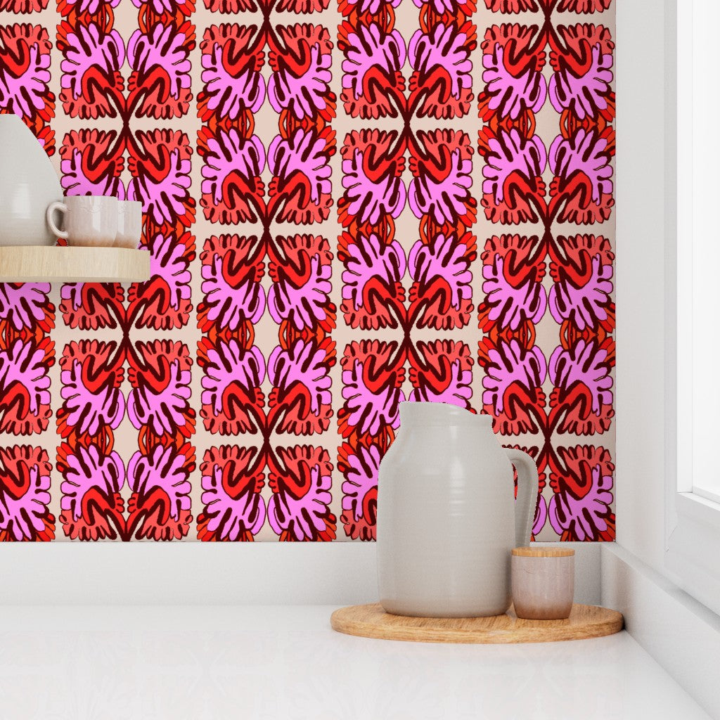 Decorative wall with pink and red abstract pattern, white pitcher on a wooden tray. Designed by artist Leila Simon Hayes.