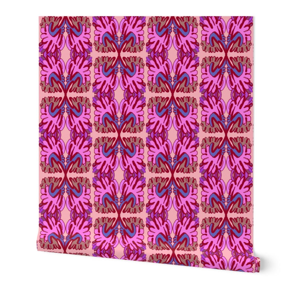 Pink and purple patterned roll of wallpaper on a white background. Designed by artist Leila Simon Hayes.
