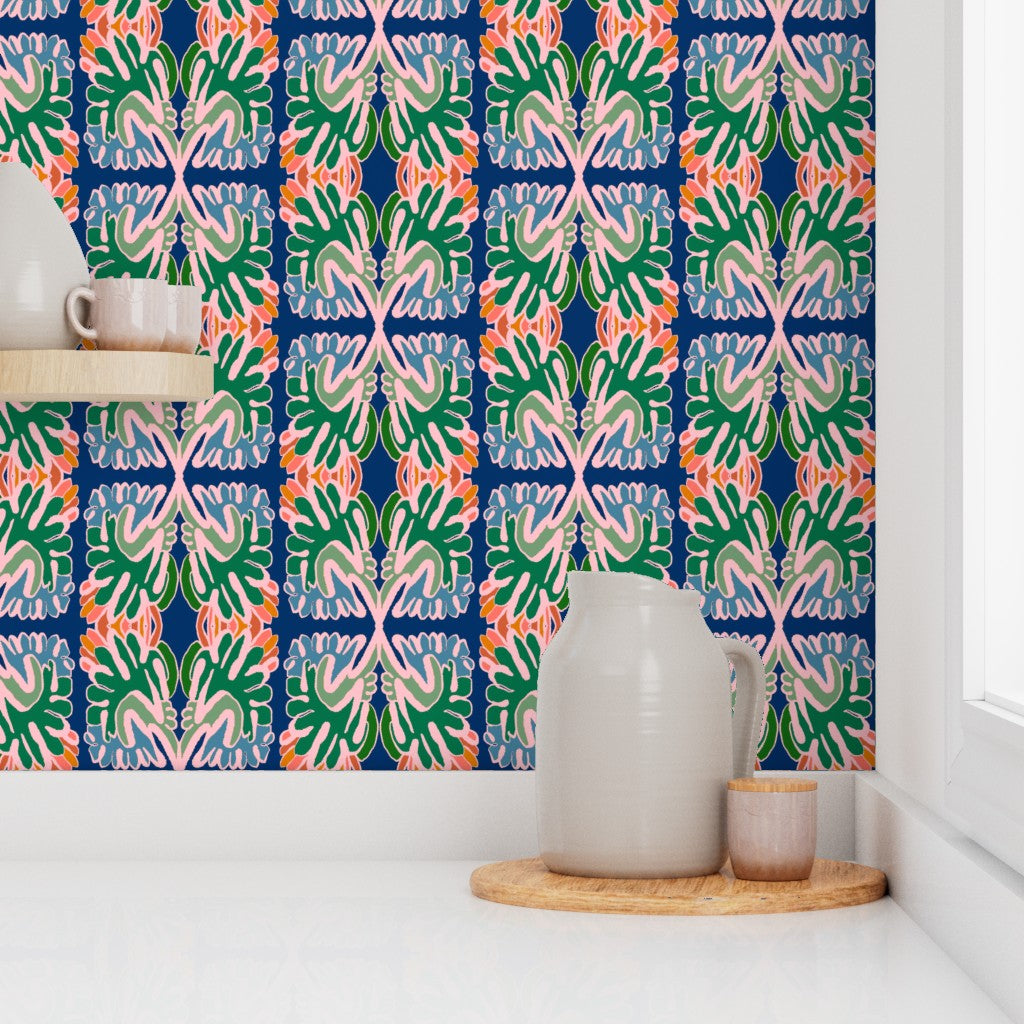 Decorative wallpaper with colorful geometric pattern, ceramic pitcher on a wooden tray. Designed by artist Leila Simon Hayes. 