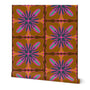 A roll of wallpaper featuring a retro 1970s floral pattern with brown, pink, teal, and navy blue geometric flower motifs. Designed by artist Leila Simon Hayes.