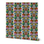 A roll of wallpaper with a vibrant, multicolored vertical damask pattern on a white background, shown slightly angled to reveal the roll's depth and a small yellow brand tag on the bottom right. Designed by artist Leila Simon Hayes.