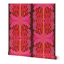 A roll of wallpaper featuring a bold, symmetrical retro floral pattern in vibrant pink, magenta, red, and purple on a dark brown background, shown against a plain white studio backdrop. Designed by artist Leila Simon Hayes.