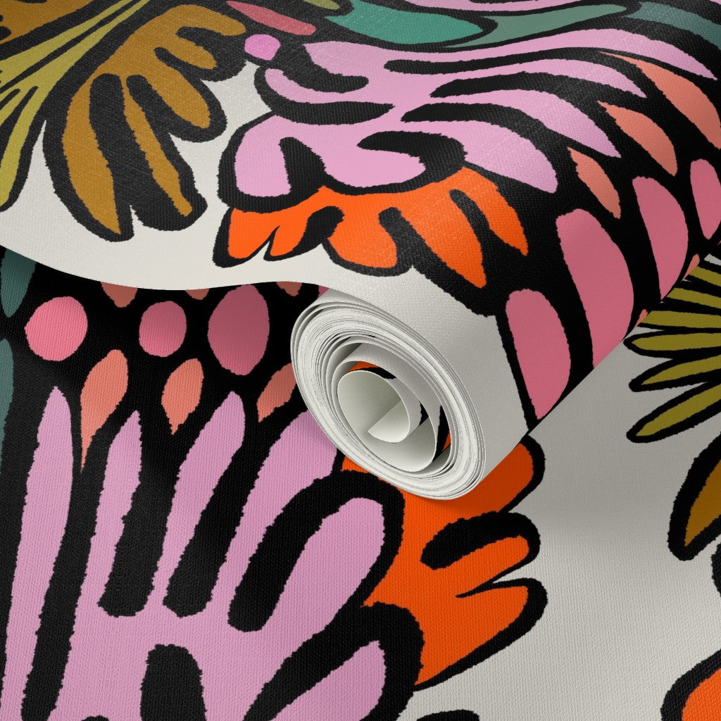 A roll of wallpaper featuring a bold, retro-style abstract pattern in pink, orange, yellow, green, and black on a white base. Designed by artist Leila Simon Hayes.