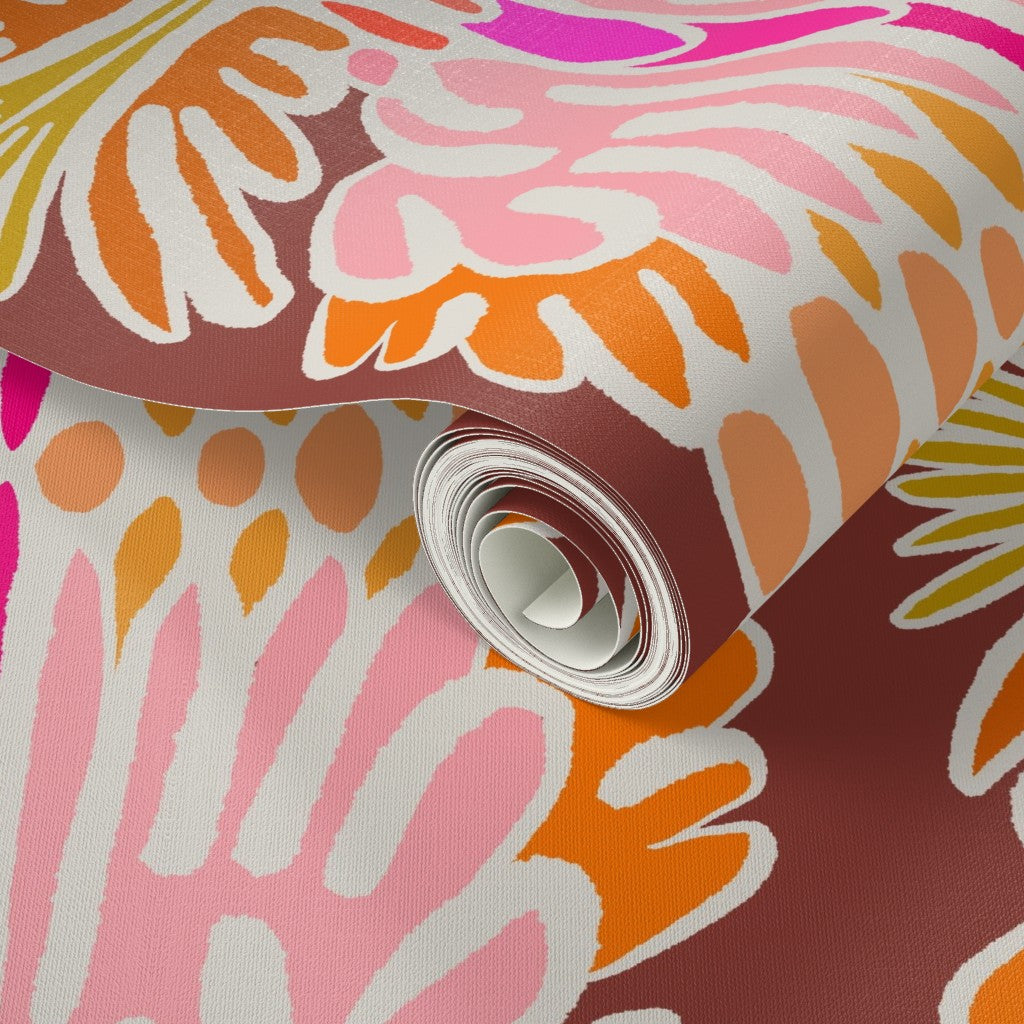 A roll of wallpaper featuring a bold, retro abstract floral pattern in pink, orange, white, and brown. Designed by artist Leila Simon Hayes.