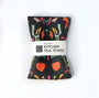 Colorful kitchen tea towel with a pattern on a white background. Designed by artist Leila Simon Hayes.