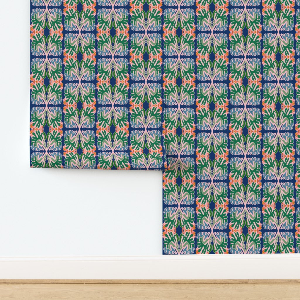 Green, blue and pink wallpaper with a geometric pattern on a white background. Designed by artist Leila Simon Hayes. 
