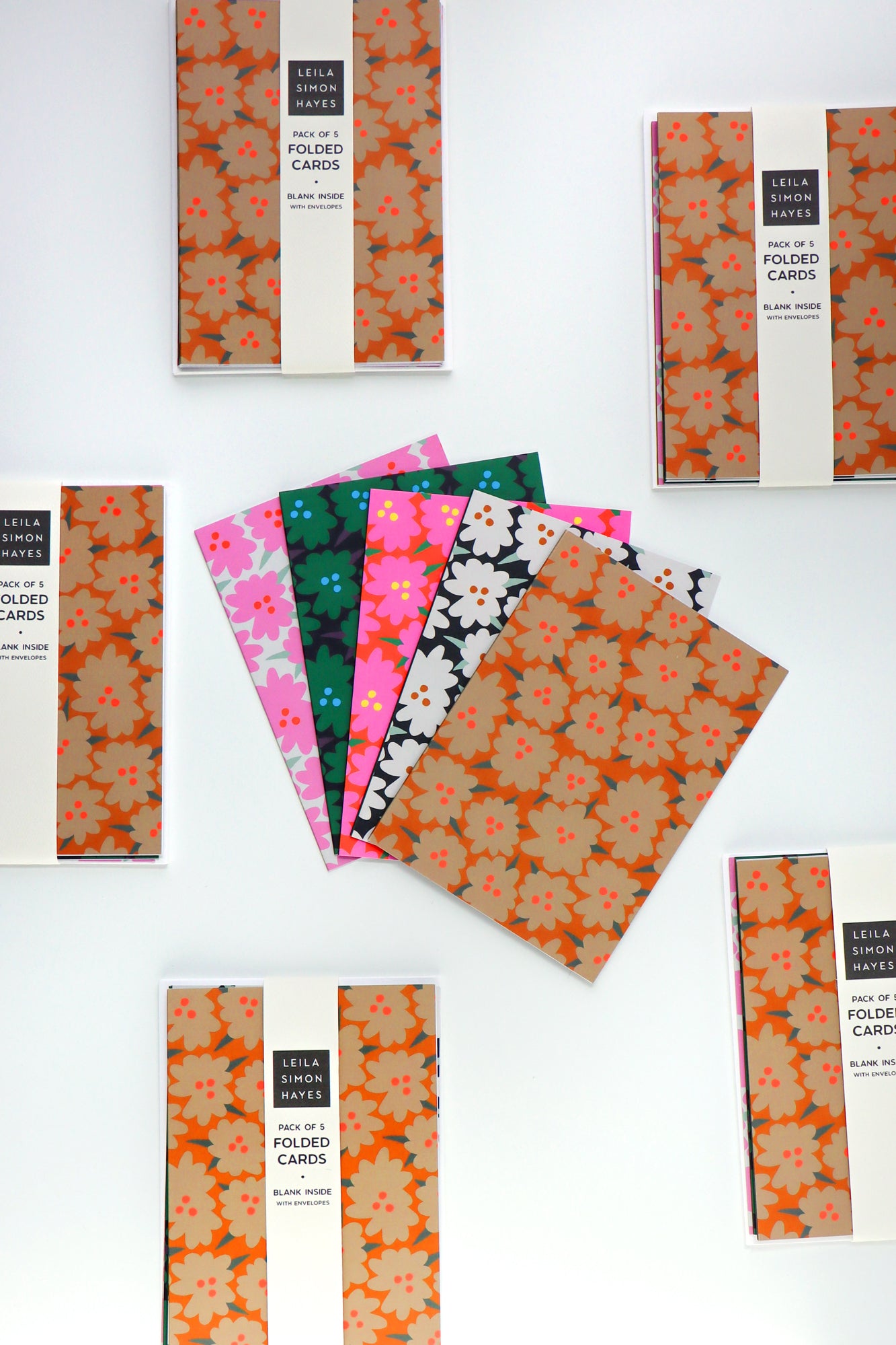 Pack of five abstract floral folded cards on a white background. Designed by artist Leila Simon Hayes.