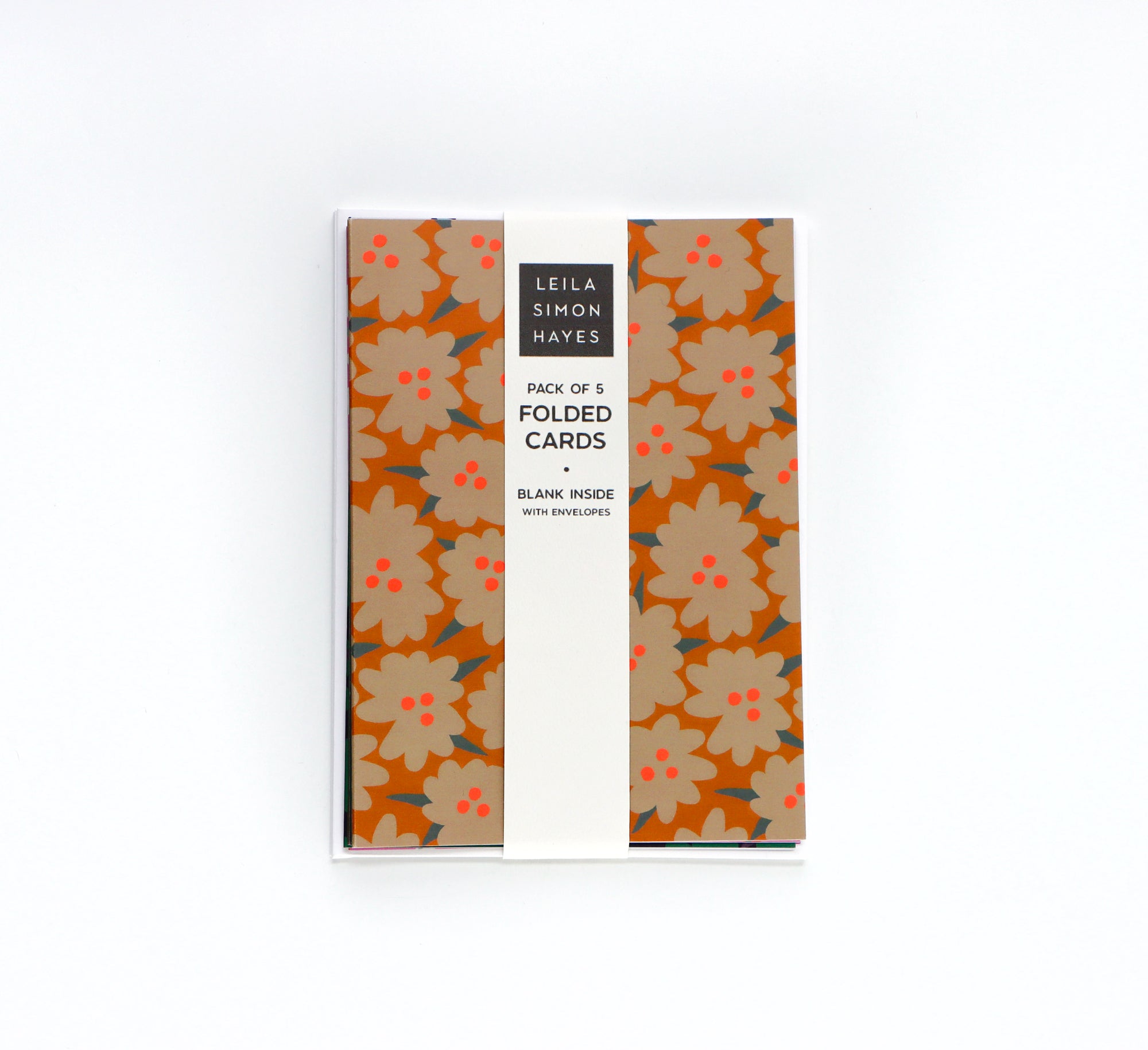 Pack of five abstract floral folded cards with a label saying "Pack of 5 Folded Cards, Blank inside with envelopes" on a white background. Designed by artist Leila Simon Hayes.