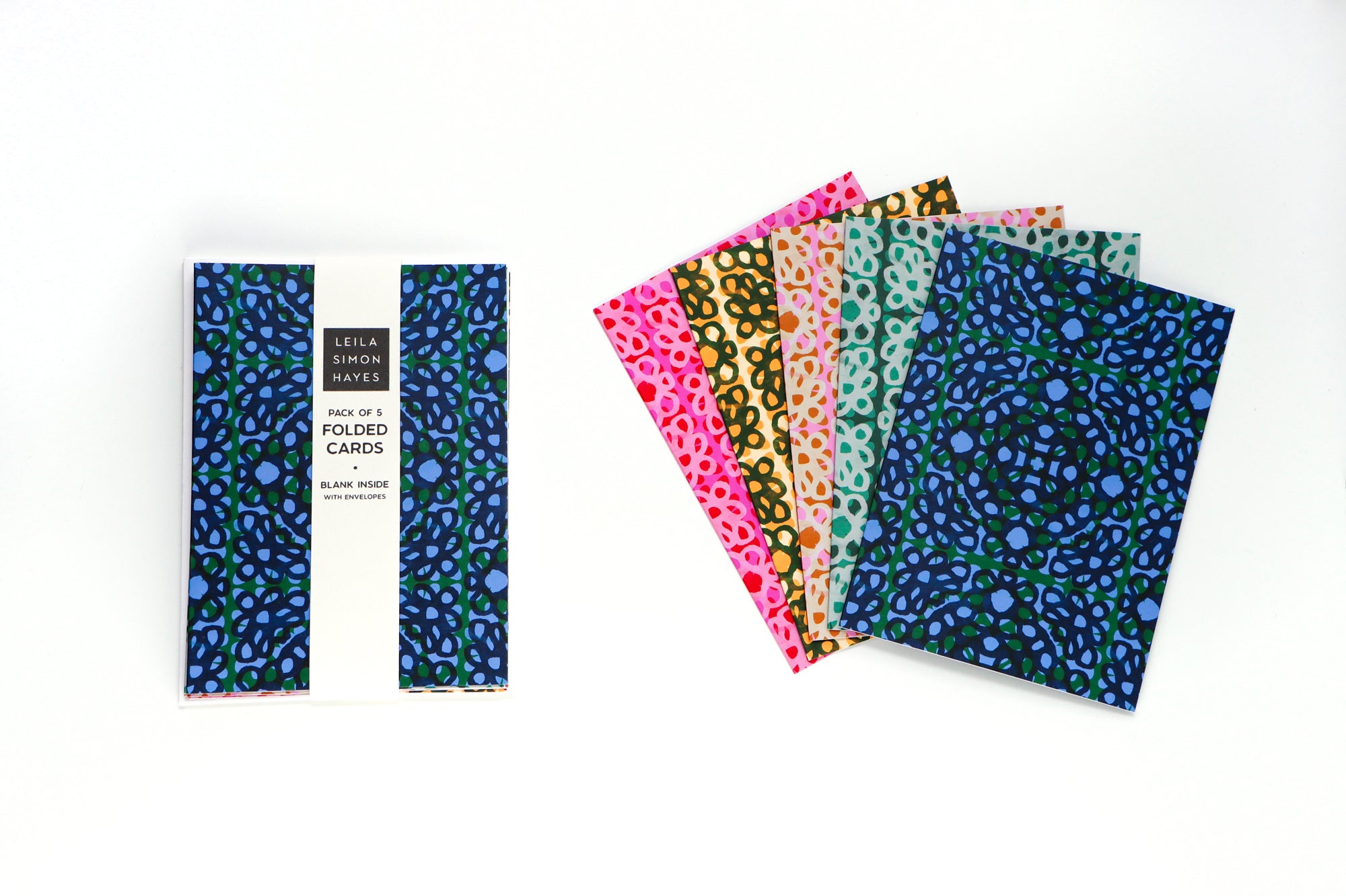 Pack of five floral loop patterned folded cards with different colors and white envelopes on a white background. Designed by artist Leila Simon Hayes.
