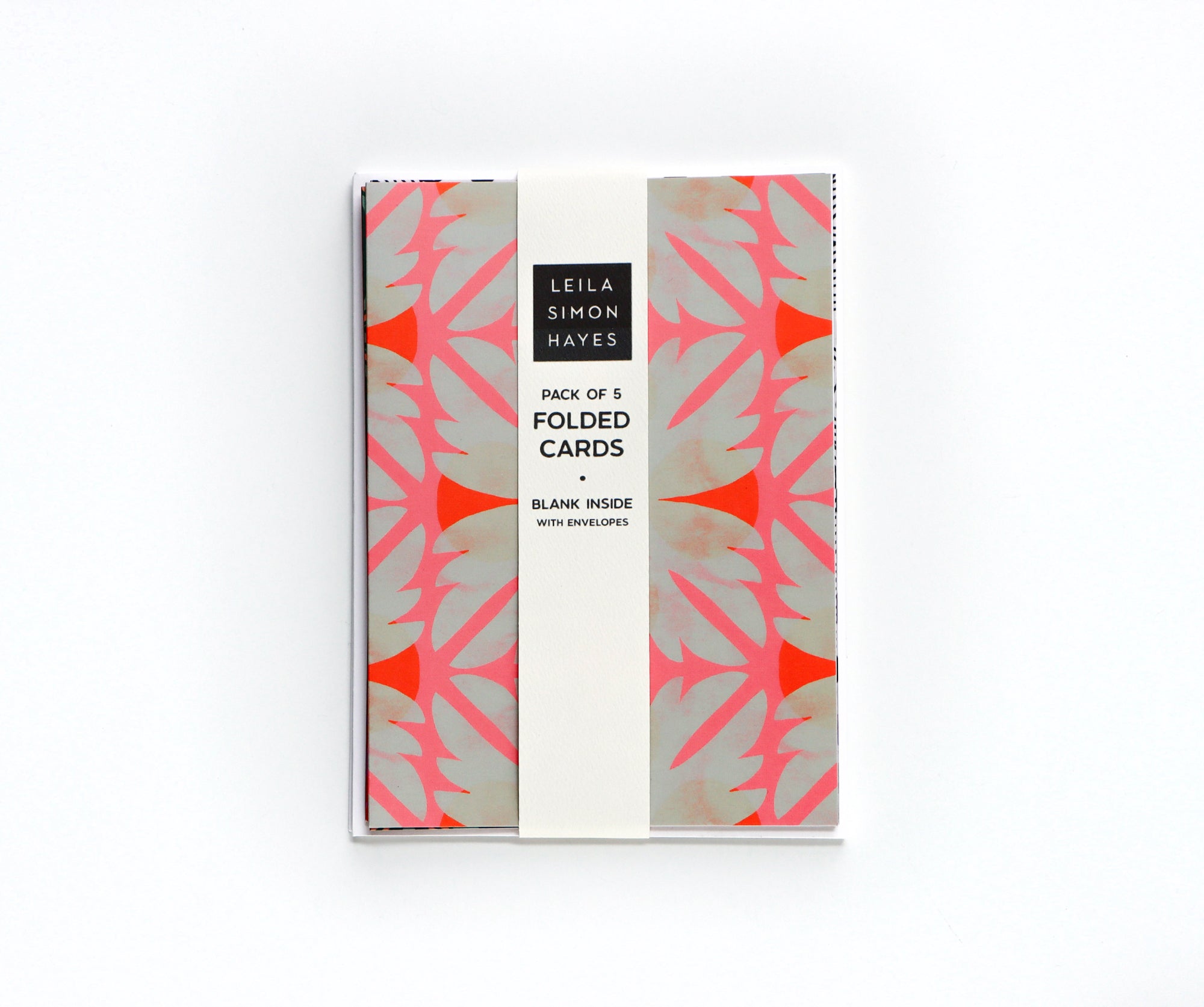 Pack of folded cards with geometric design on a white background, with a label saying "Pack of 5 Folded Cards, blank inside with envelopes", designed by artist Leila Simon Hayes.