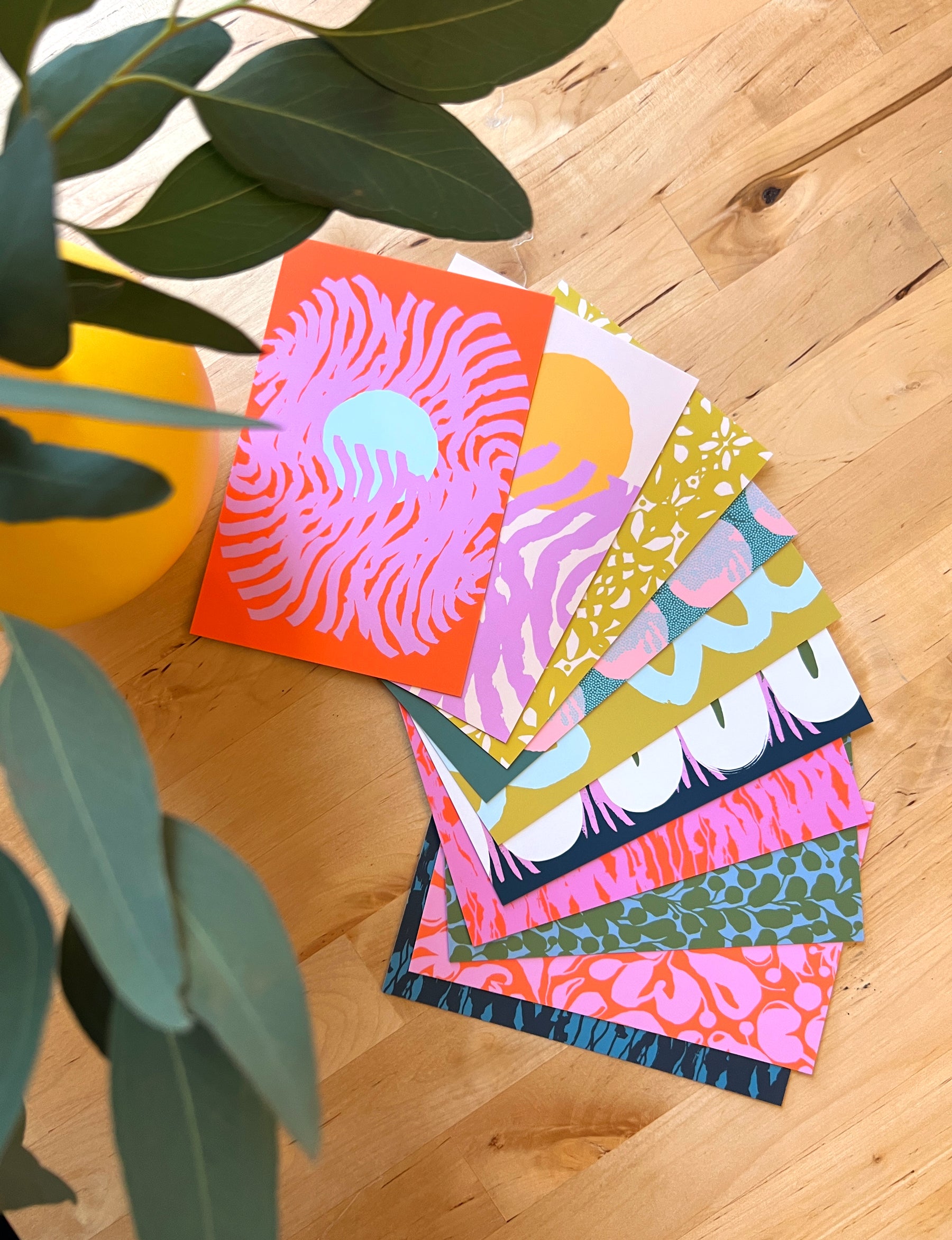 10 colorful and abstract postcards, designed by artist Leila Simon Hayes.