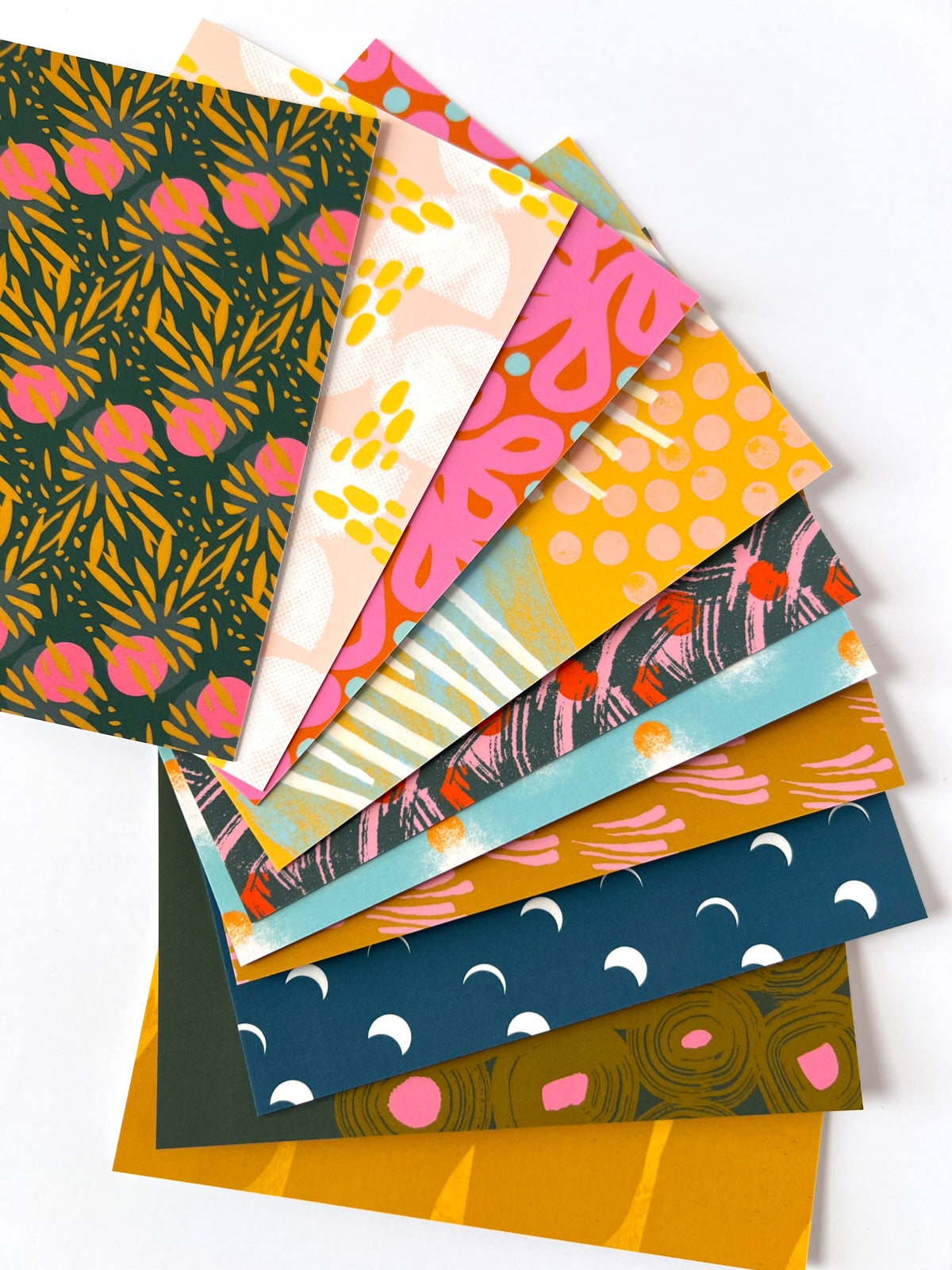 Set of 10 colorful patterned postcards on a white background, designed by artist Leila Simon Hayes.