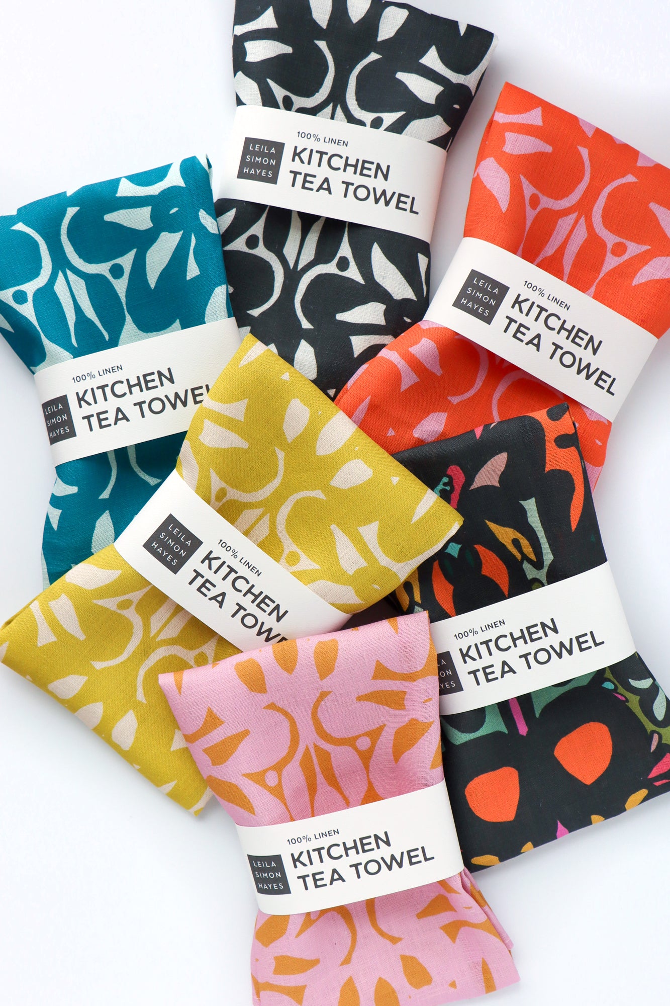 Set of colorful kitchen tea towels with patterns on white background