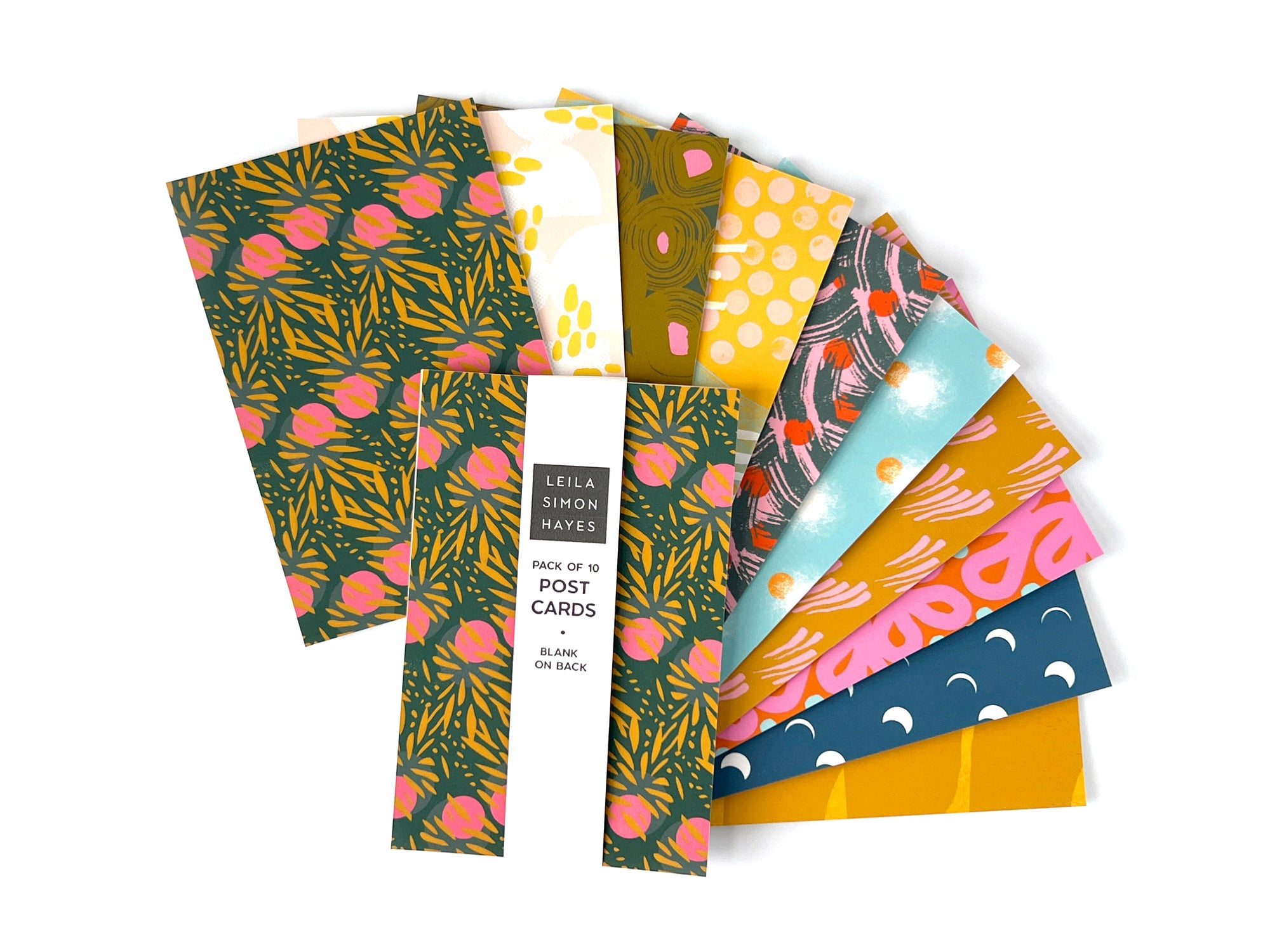 Pack of 10 colorful postcards with various abstract patterns and a blank side for writing messages. Designed by artist Leila Simon Hayes.
